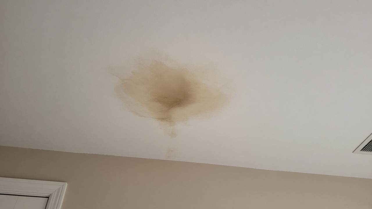 Illustrative example of a ceiling water stain from a roof leak — not work performed by League City Roofing Estimates.